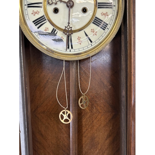 31 - Two wall clocks, one Victorian walnut and mahogany cased Vienna and one Comitti of London mahogany c... 