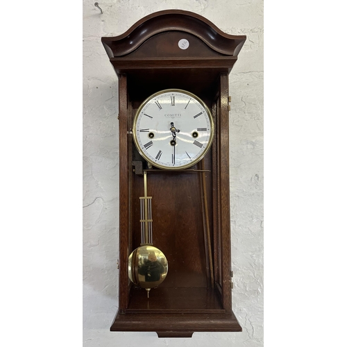 31 - Two wall clocks, one Victorian walnut and mahogany cased Vienna and one Comitti of London mahogany c... 