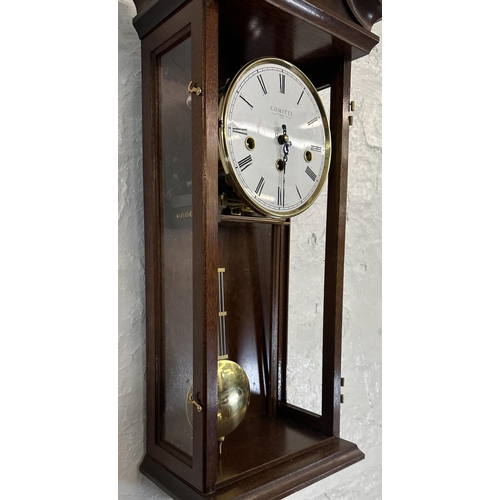 31 - Two wall clocks, one Victorian walnut and mahogany cased Vienna and one Comitti of London mahogany c... 