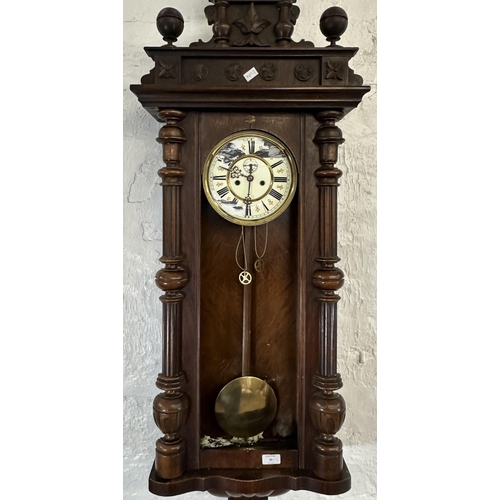 31 - Two wall clocks, one Victorian walnut and mahogany cased Vienna and one Comitti of London mahogany c... 