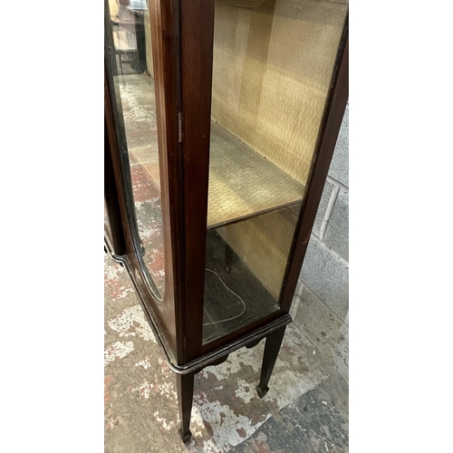 34 - An Edwardian inlaid mahogany display cabinet on tapering supports - approx. 165cm high x 113cm wide ... 