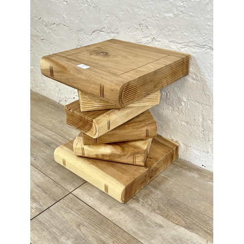 4 - A contemporary carved hardwood novelty book stack side table - approx. 41cm high x 33cm wide x 33cm ... 