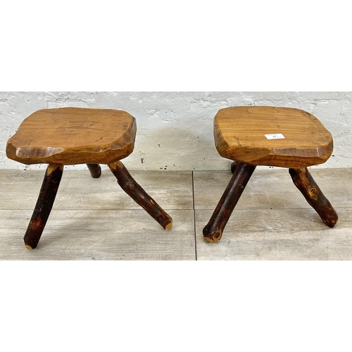 43 - A pair of Brutalist style rustic elm tripod stools - approx. 26cm high x 25cm wide x 21cm deep