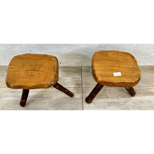 43 - A pair of Brutalist style rustic elm tripod stools - approx. 26cm high x 25cm wide x 21cm deep