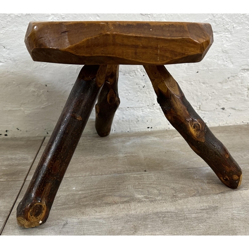 43 - A pair of Brutalist style rustic elm tripod stools - approx. 26cm high x 25cm wide x 21cm deep