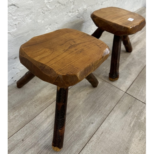 43 - A pair of Brutalist style rustic elm tripod stools - approx. 26cm high x 25cm wide x 21cm deep