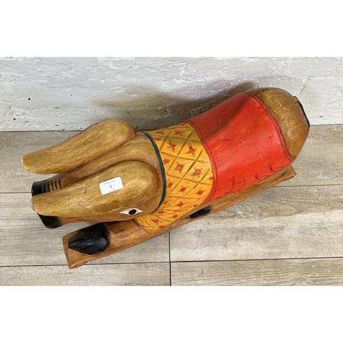 5 - A carved hardwood and hand painted rocking pig - approx. 36cm high x 60cm long