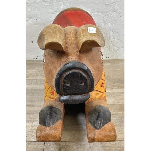 5 - A carved hardwood and hand painted rocking pig - approx. 36cm high x 60cm long