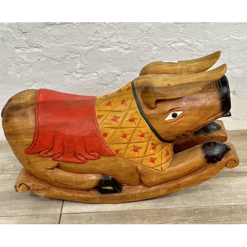 5 - A carved hardwood and hand painted rocking pig - approx. 36cm high x 60cm long