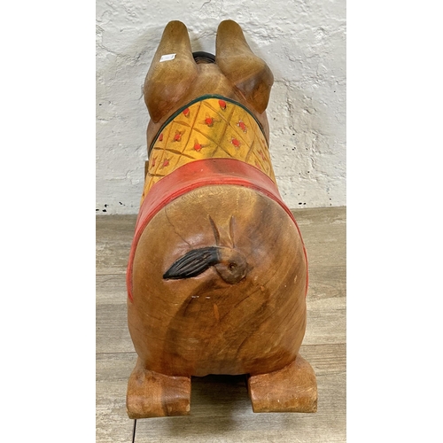 5 - A carved hardwood and hand painted rocking pig - approx. 36cm high x 60cm long