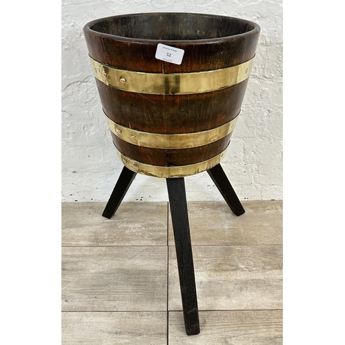 52 - An early 20th century coopered oak and brass planter on stand - approx. 59cm high x 31cm diameter