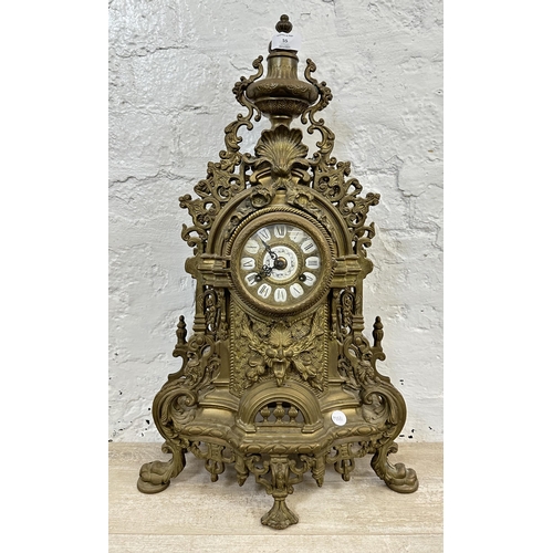 55 - A French Louis XV style brass mantel clock - approx. 60cm high