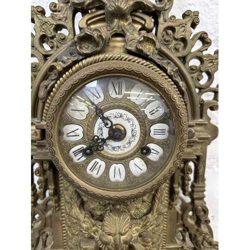 55 - A French Louis XV style brass mantel clock - approx. 60cm high