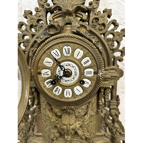 55 - A French Louis XV style brass mantel clock - approx. 60cm high