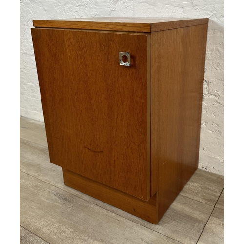 57 - Two mid 20th century teak bedside cabinets - largest approx. 69cm high x 40cm wide x 36cm deep