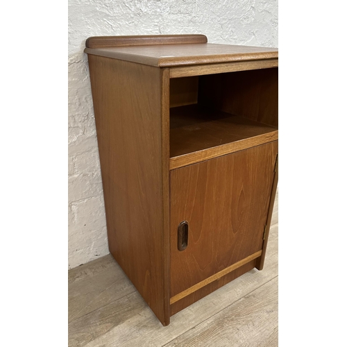 57 - Two mid 20th century teak bedside cabinets - largest approx. 69cm high x 40cm wide x 36cm deep