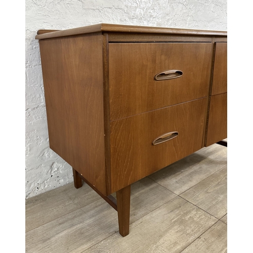 58 - A mid 20th century teak concave chest of drawers - approx. 72cm high x 108cm wide x 44cm deep