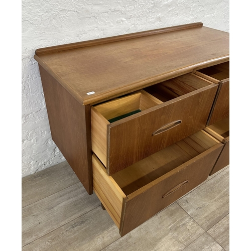 58 - A mid 20th century teak concave chest of drawers - approx. 72cm high x 108cm wide x 44cm deep