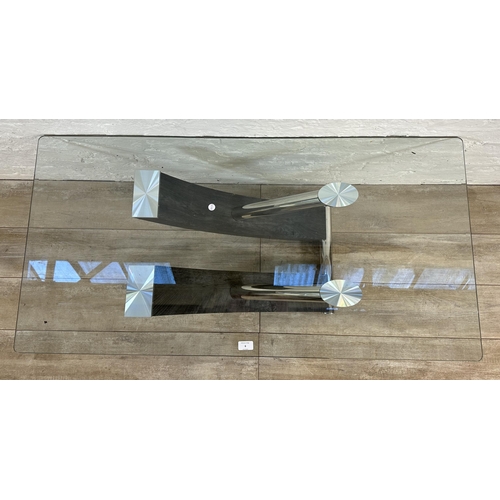 6 - A contemporary bevelled glass coffee table on chrome plated and black wood effect base - approx. 45c... 