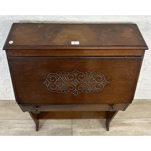 61 - A mid 20th century carved oak student's bureau bookcase - approx. 101cm high x 69cm wide x 32cm deep