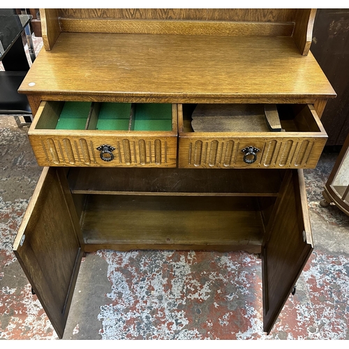 67 - A carved oak linenfold Dutch dresser - approx. 178cm high x 95cm wide x 44cm deep