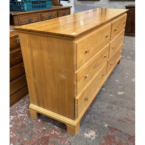 68D - A contemporary oak chest of drawers - approx. 81cm high x 158cm wide x 47cm deep