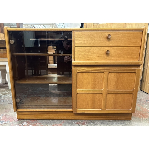 69 - A mid 20th century Nathan teak and smoked glass hi-fi stereo cabinet - approx. 75cm high x 100cm wid... 