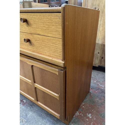 69 - A mid 20th century Nathan teak and smoked glass hi-fi stereo cabinet - approx. 75cm high x 100cm wid... 