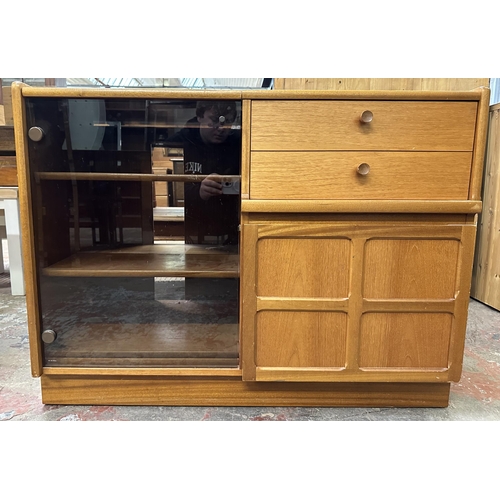 69 - A mid 20th century Nathan teak and smoked glass hi-fi stereo cabinet - approx. 75cm high x 100cm wid... 