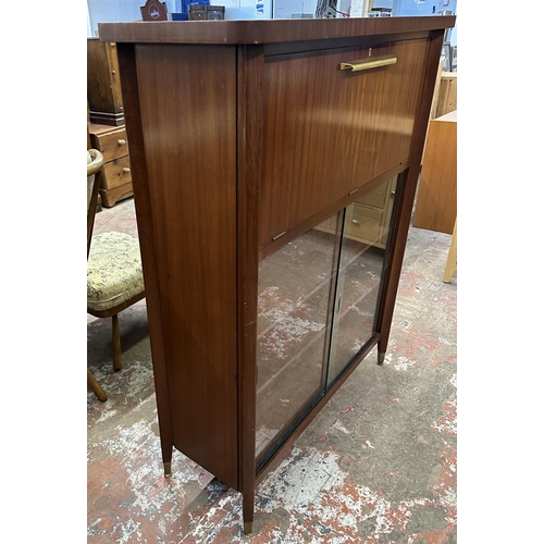 74 - A mid 20th century teak cocktail cabinet - approx. 135cm high x 110cm wide x 40.5cm deep