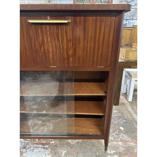 74 - A mid 20th century teak cocktail cabinet - approx. 135cm high x 110cm wide x 40.5cm deep