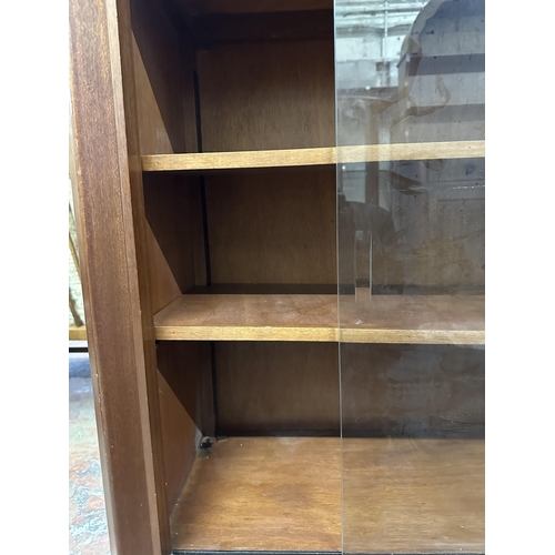 74 - A mid 20th century teak cocktail cabinet - approx. 135cm high x 110cm wide x 40.5cm deep