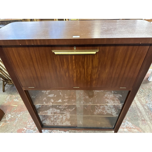 74 - A mid 20th century teak cocktail cabinet - approx. 135cm high x 110cm wide x 40.5cm deep