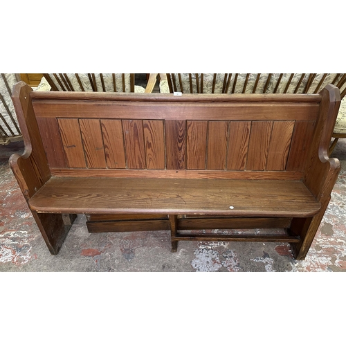 75 - A Victorian pitch pine church pew - approx. 92cm high x 145cm wide x 45cm deep