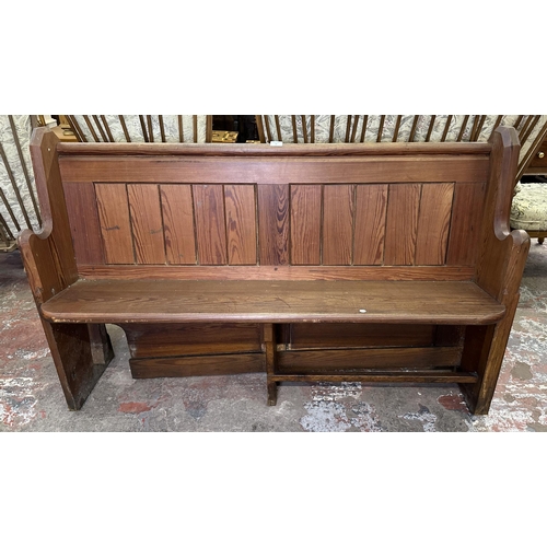 75 - A Victorian pitch pine church pew - approx. 92cm high x 145cm wide x 45cm deep