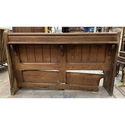 75 - A Victorian pitch pine church pew - approx. 92cm high x 145cm wide x 45cm deep