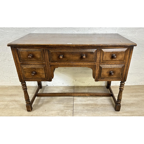 80 - An Ipswich style oak dressing table/writing desk - approx. 77cm high x 106cm wide x 53cm deep