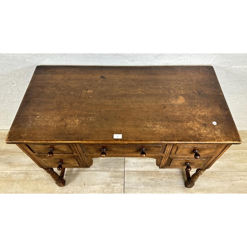 80 - An Ipswich style oak dressing table/writing desk - approx. 77cm high x 106cm wide x 53cm deep