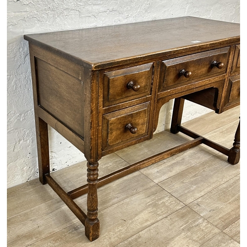 80 - An Ipswich style oak dressing table/writing desk - approx. 77cm high x 106cm wide x 53cm deep