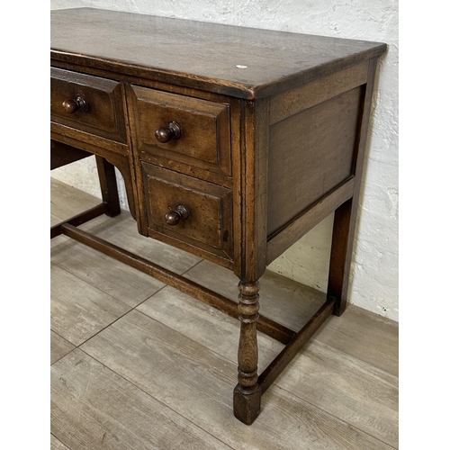 80 - An Ipswich style oak dressing table/writing desk - approx. 77cm high x 106cm wide x 53cm deep