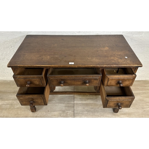 80 - An Ipswich style oak dressing table/writing desk - approx. 77cm high x 106cm wide x 53cm deep