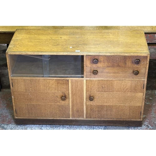 82 - A mid 20th century oak sideboard - approx. 81cm high x 122cm wide x 46cm deep