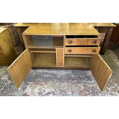 82 - A mid 20th century oak sideboard - approx. 81cm high x 122cm wide x 46cm deep