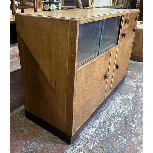 82 - A mid 20th century oak sideboard - approx. 81cm high x 122cm wide x 46cm deep