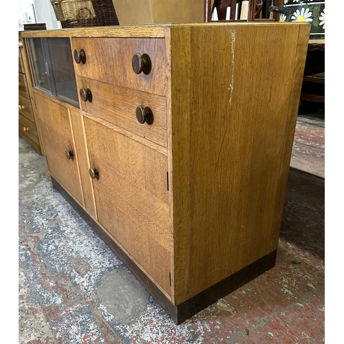 82 - A mid 20th century oak sideboard - approx. 81cm high x 122cm wide x 46cm deep