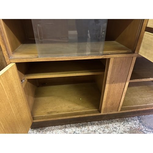 82 - A mid 20th century oak sideboard - approx. 81cm high x 122cm wide x 46cm deep