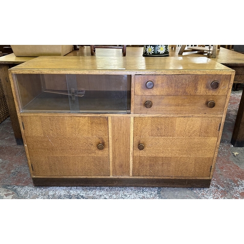 82 - A mid 20th century oak sideboard - approx. 81cm high x 122cm wide x 46cm deep