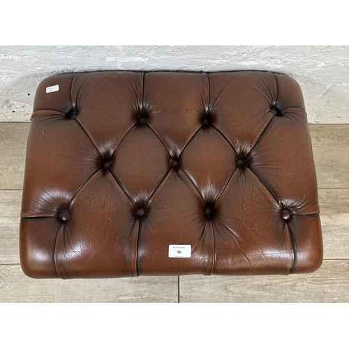 86 - A brown leather Chesterfield footstool on mahogany cabriole supports - approx. 33cm high x 56cm wide... 