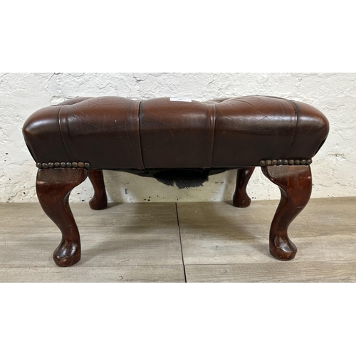 86 - A brown leather Chesterfield footstool on mahogany cabriole supports - approx. 33cm high x 56cm wide... 