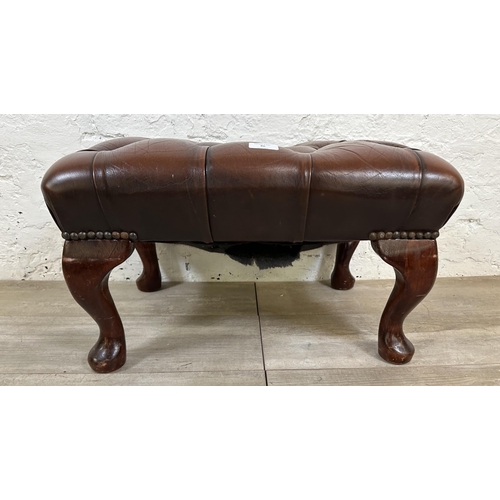 86 - A brown leather Chesterfield footstool on mahogany cabriole supports - approx. 33cm high x 56cm wide... 